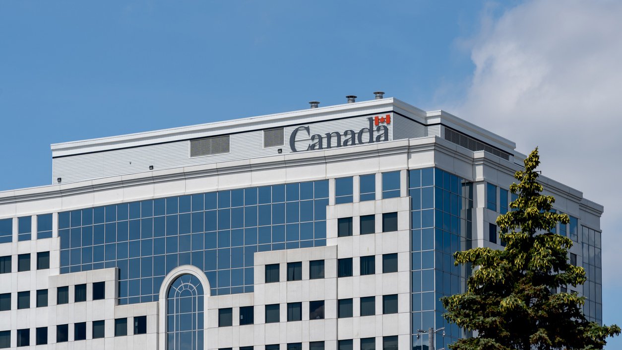 A photo of a Government of Canada building with blue skies in the background.
