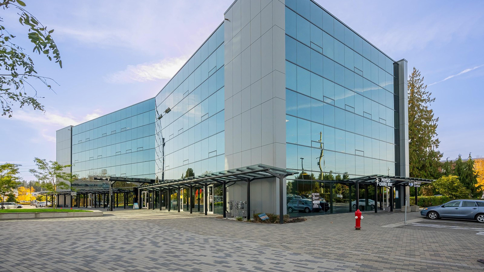 Exterior of DMCL&rsquo;s new Surrey office building at 15350 Croydon Drive, featuring a modern glass fa&ccedil;ade.